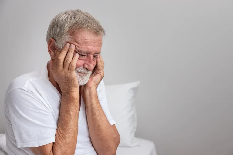 alzheimer'study - Senior elderly man sitting on bed with depressed after waking up in morning