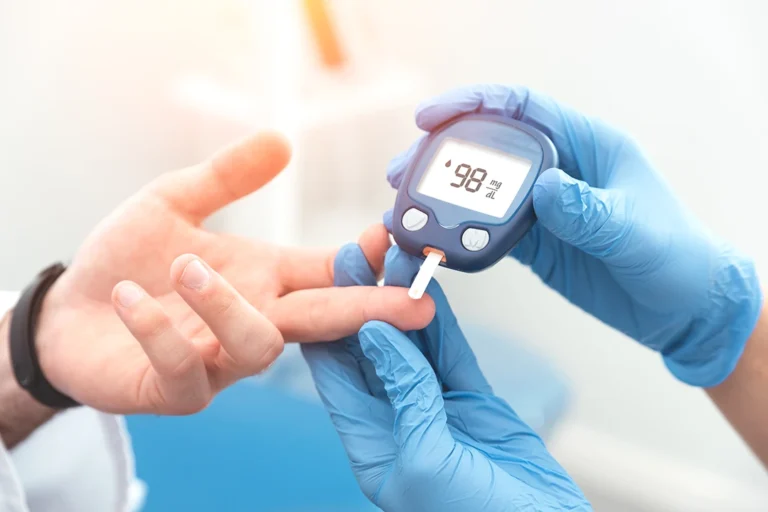 Diabetes type 2 study - Doctor checking blood sugar level with glucometer. Treatment of diabetes concept.